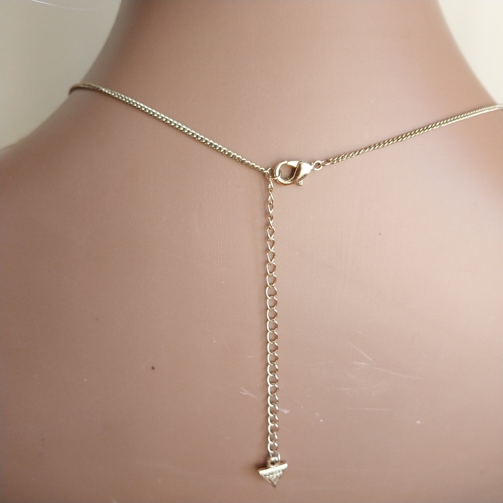 Guess Gold and Crystal Pendant Necklace - Picture 5 of 13